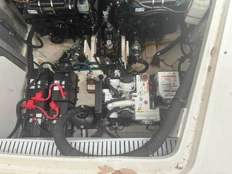 Slide: The Image of Engine compartment of 2012 Sea Ray 330 Sundancer with visible batteries and mechanical components. - 41