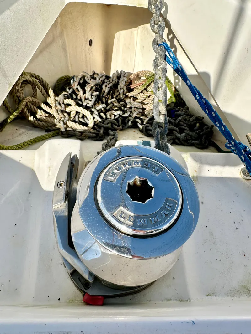 Slide: The Image of Anchor windlass on 2014 Hunter 33 sailboat with coiled rope and chain. - 12