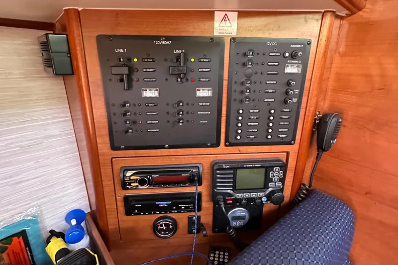 Slide: The Image of Control panel of a 2014 Hunter 33 sailboat with navigation and communication equipment. - 28