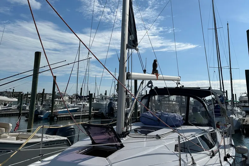 Slide: The Image of Sailboat Hunter 33, 2014 model, docked at marina under clear blue sky. - 8