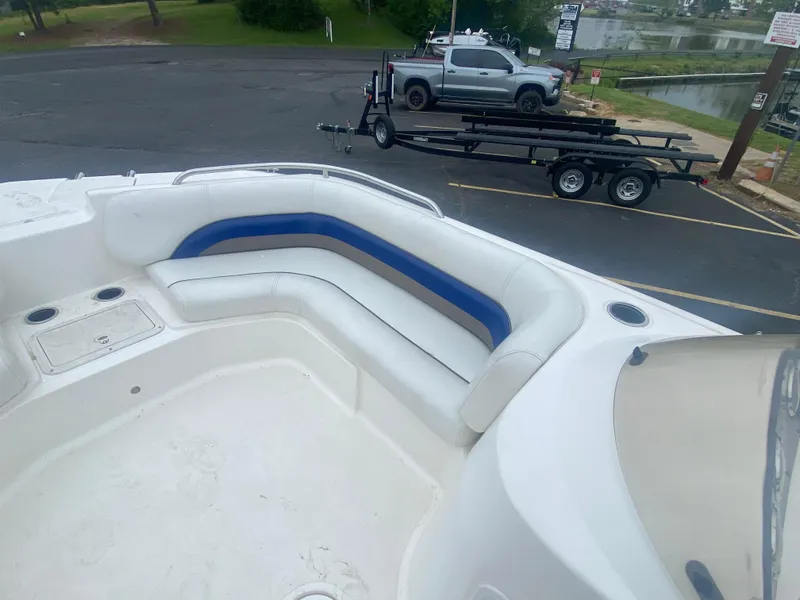 Slide: The Image of 2012 Hurricane SunDeck Sport 201 OB boat with white and blue seating. - 15
