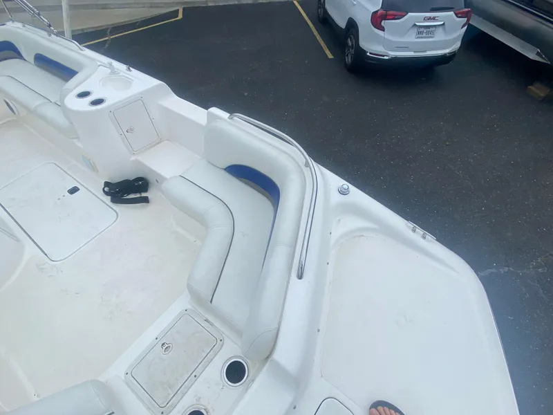 Slide: The Image of 2012 Hurricane SunDeck Sport 201 OB boat interior with seating and storage compartments. - 16