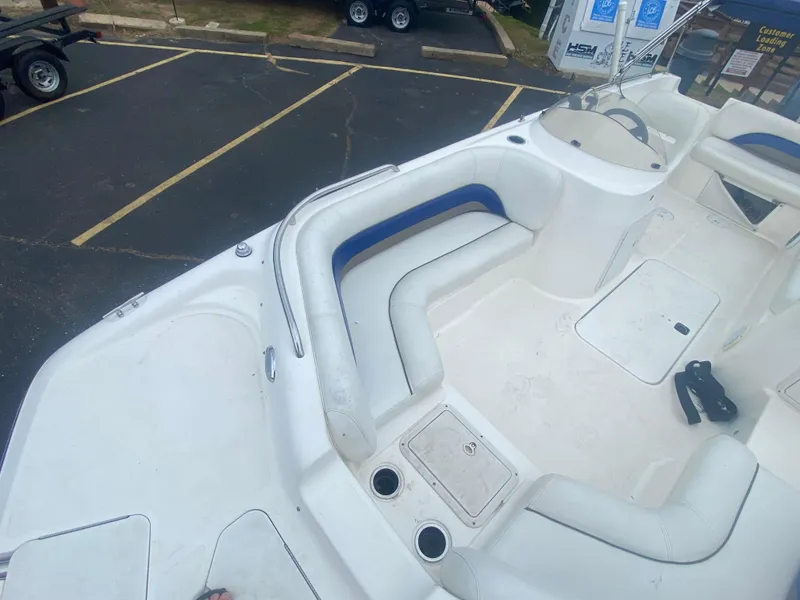 Slide: The Image of 2012 Hurricane SunDeck Sport 201 OB boat interior with seating and storage compartments. - 18