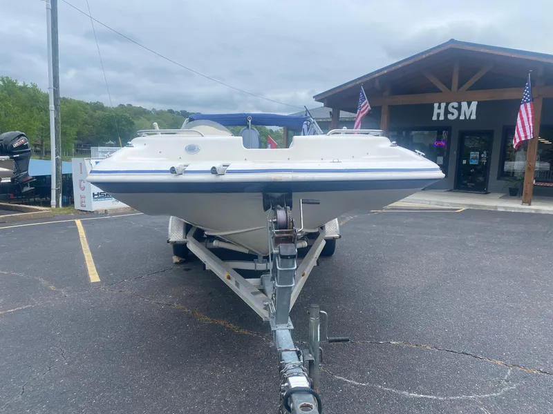 Slide: The Image of 2012 Hurricane SunDeck Sport 201 OB boat on a trailer in front of HSM building. - 3