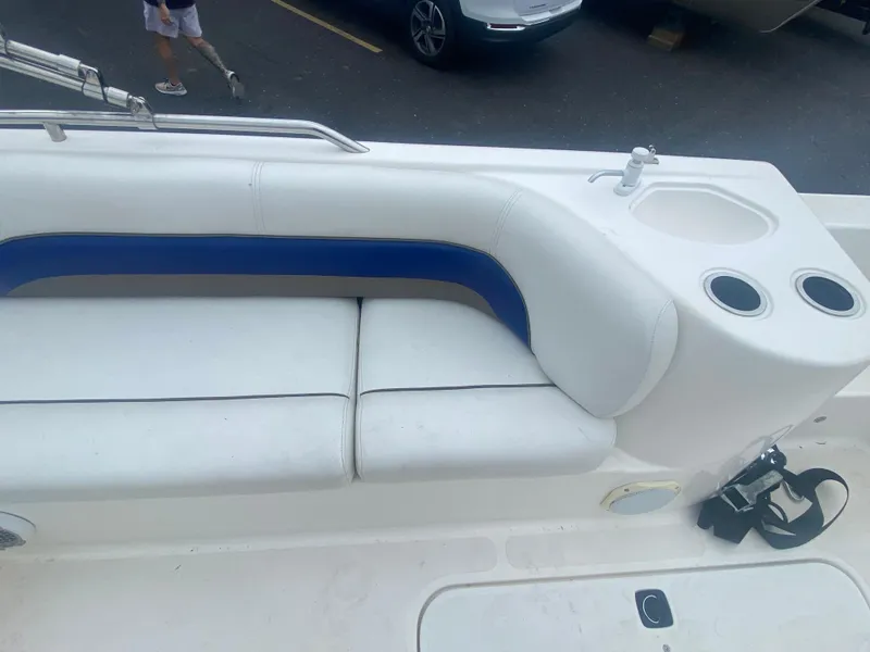 Slide: The Image of 2012 Hurricane SunDeck Sport 201 OB boat with white and blue seating. - 9