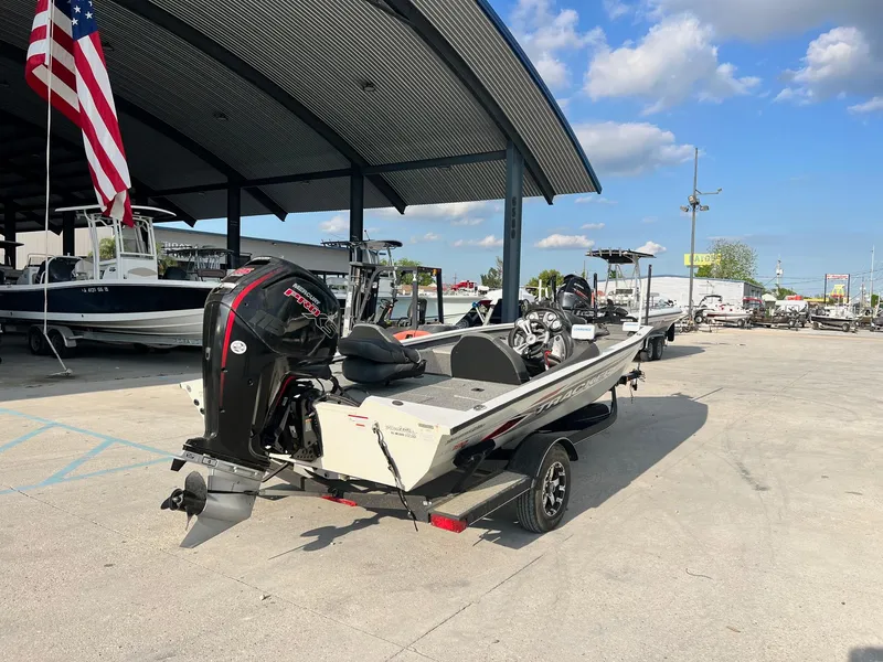 Slide: The Image of 2020 Tracker Pro Team 190 TX Tournament Edition boat at a marina. - 2