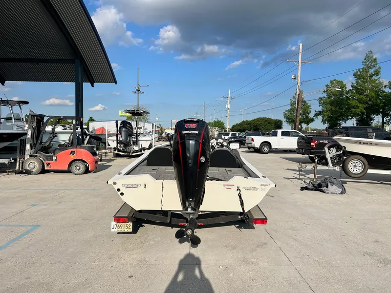 Slide: The Image of 2020 Tracker Pro Team 190 TX Tournament Edition boat in a marina. - 3
