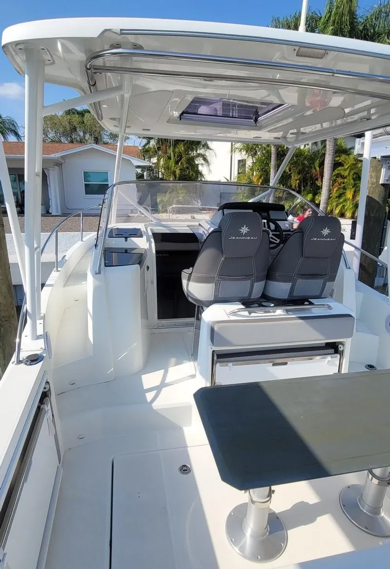 Slide: The Image of 2020 Jeanneau Leader 9.0 WA boat interior with seating and helm station. - 3