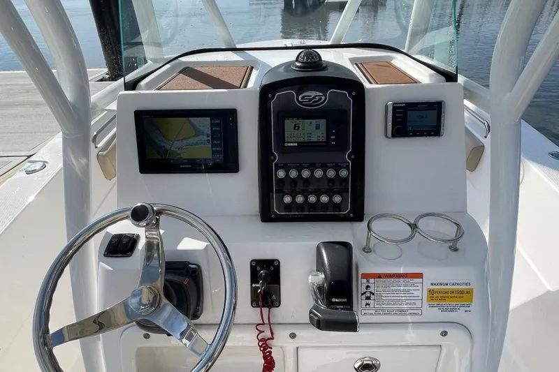 Slide: The Image of 2017 Sea Fox 248 Commander boat dashboard with navigation and control systems. - 14