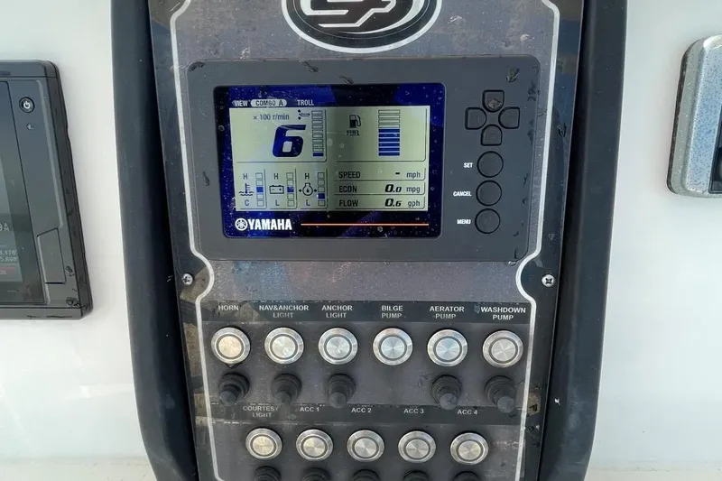 Slide: The Image of 2017 Sea Fox 248 Commander dashboard with Yamaha display and control switches. - 16