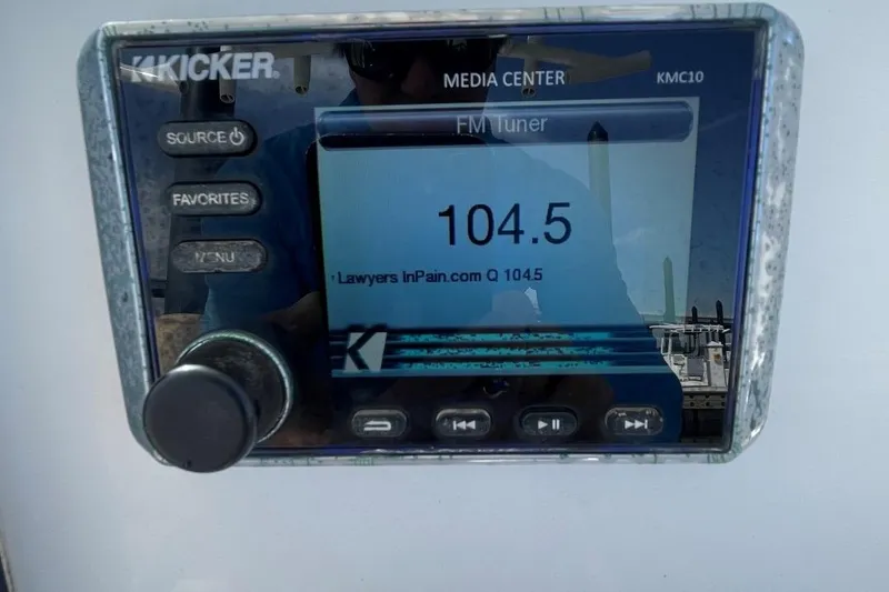 Slide: The Image of Kicker media center KMC10 displaying FM tuner on a 2017 Sea Fox 248 Commander boat. - 18