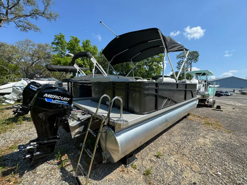Slide: The Image of 2024 Crest Classic LX 220 pontoon boat with Mercury outboard motor. - 5