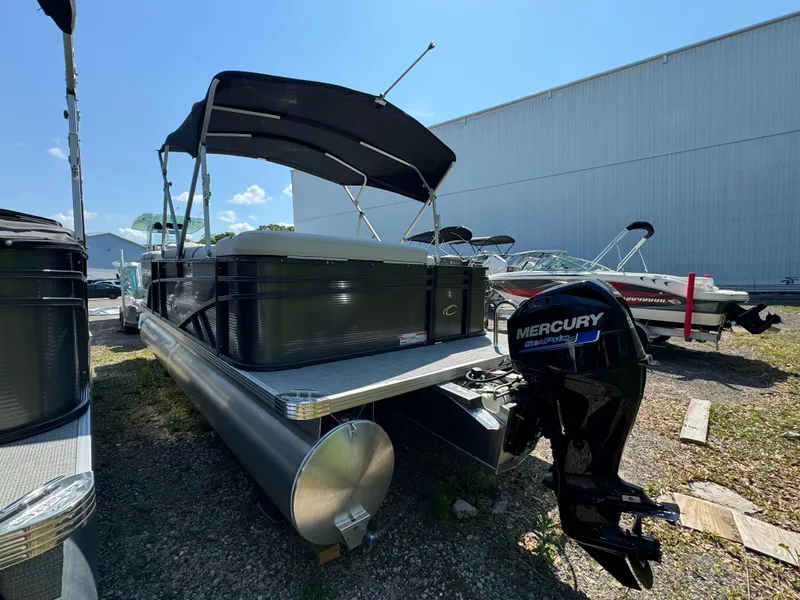 Slide: The Image of 2024 Crest Classic LX 220 pontoon boat with Mercury outboard motor. - 6