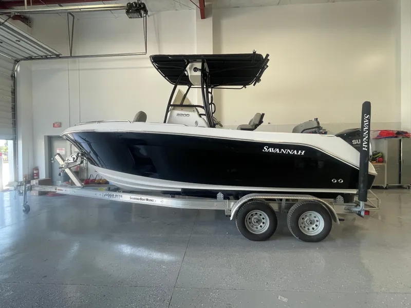 The Image of 2024 Savannah 2200 Offshore boat on trailer in garage setting. - 0