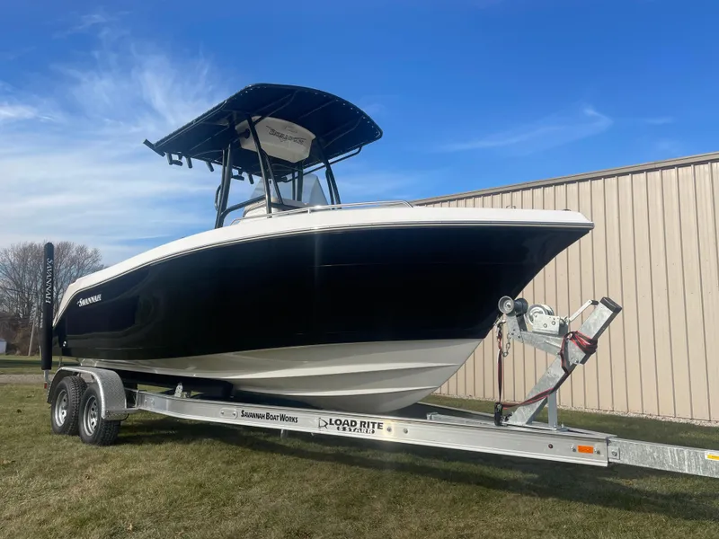 Slide: The Image of 2024 Savannah 2200 Offshore boat on a Load Rite trailer. - 2