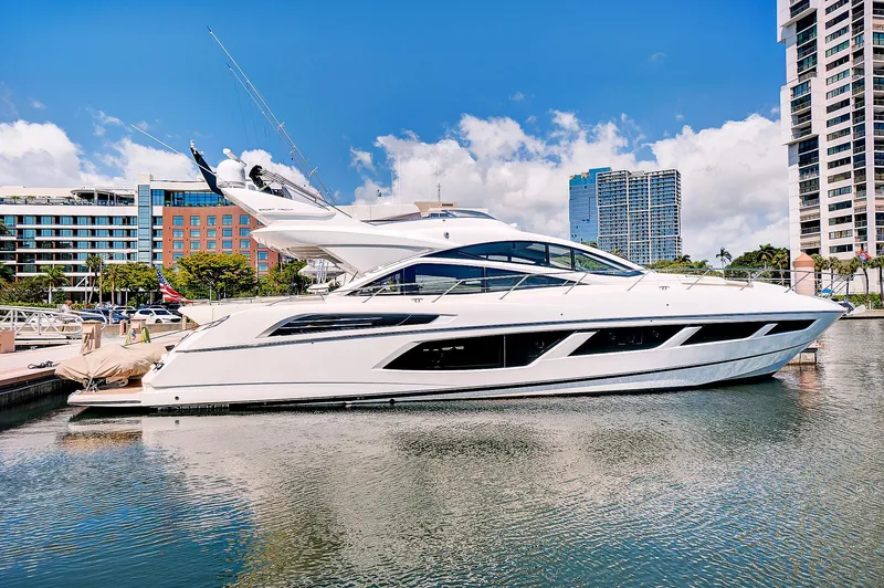 Slide: The Image of 2017 Sunseeker 68 Sport Yacht docked in a modern marina. - 0