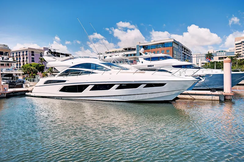 Slide: The Image of 2017 Sunseeker 68 Sport Yacht docked in a marina on a sunny day. - 1