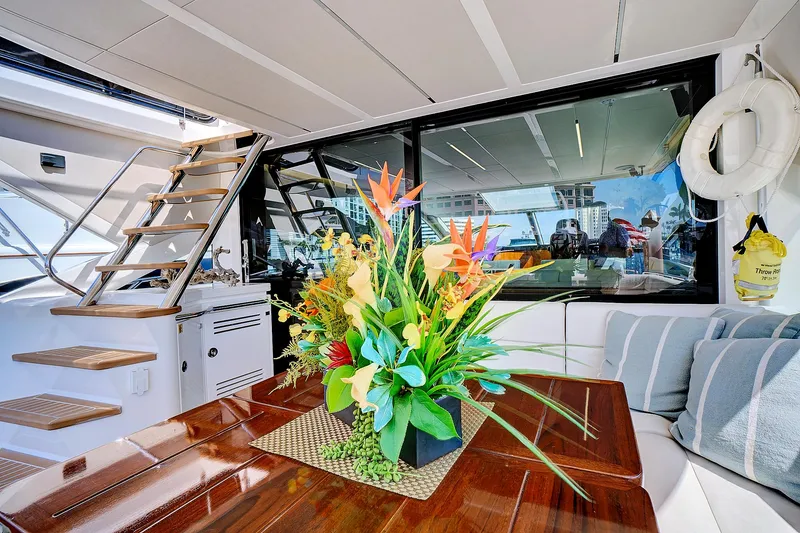 Slide: The Image of Luxurious interior of 2017 Sunseeker 68 Sport Yacht with elegant floral arrangement. - 14