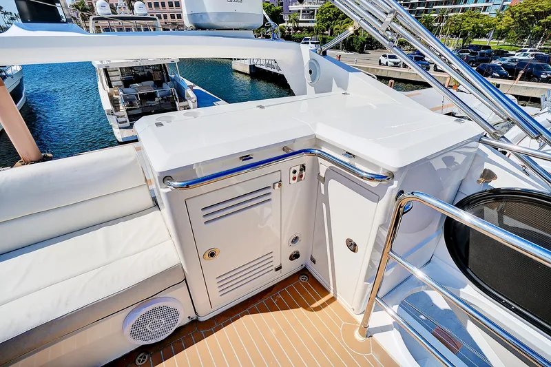 Slide: The Image of 2017 Sunseeker 68 Sport Yacht deck with seating and storage compartments. - 26