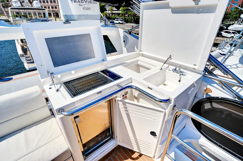 Slide: The Image of Outdoor kitchen area on 2017 Sunseeker 68 Sport Yacht with grill and sink. - 27
