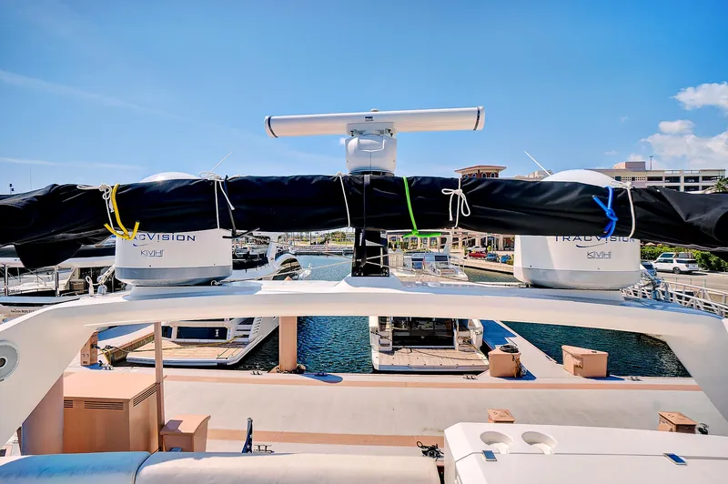 Slide: The Image of 2017 Sunseeker 68 Sport Yacht docked at a marina, rear view. - 28