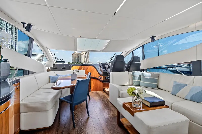 Slide: The Image of Luxurious interior of 2017 Sunseeker 68 Sport Yacht with modern furnishings and panoramic windows. - 29