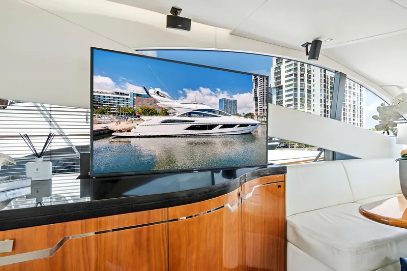 Slide: The Image of Interior of 2017 Sunseeker 68 Sport Yacht with TV and modern furnishings. - 32