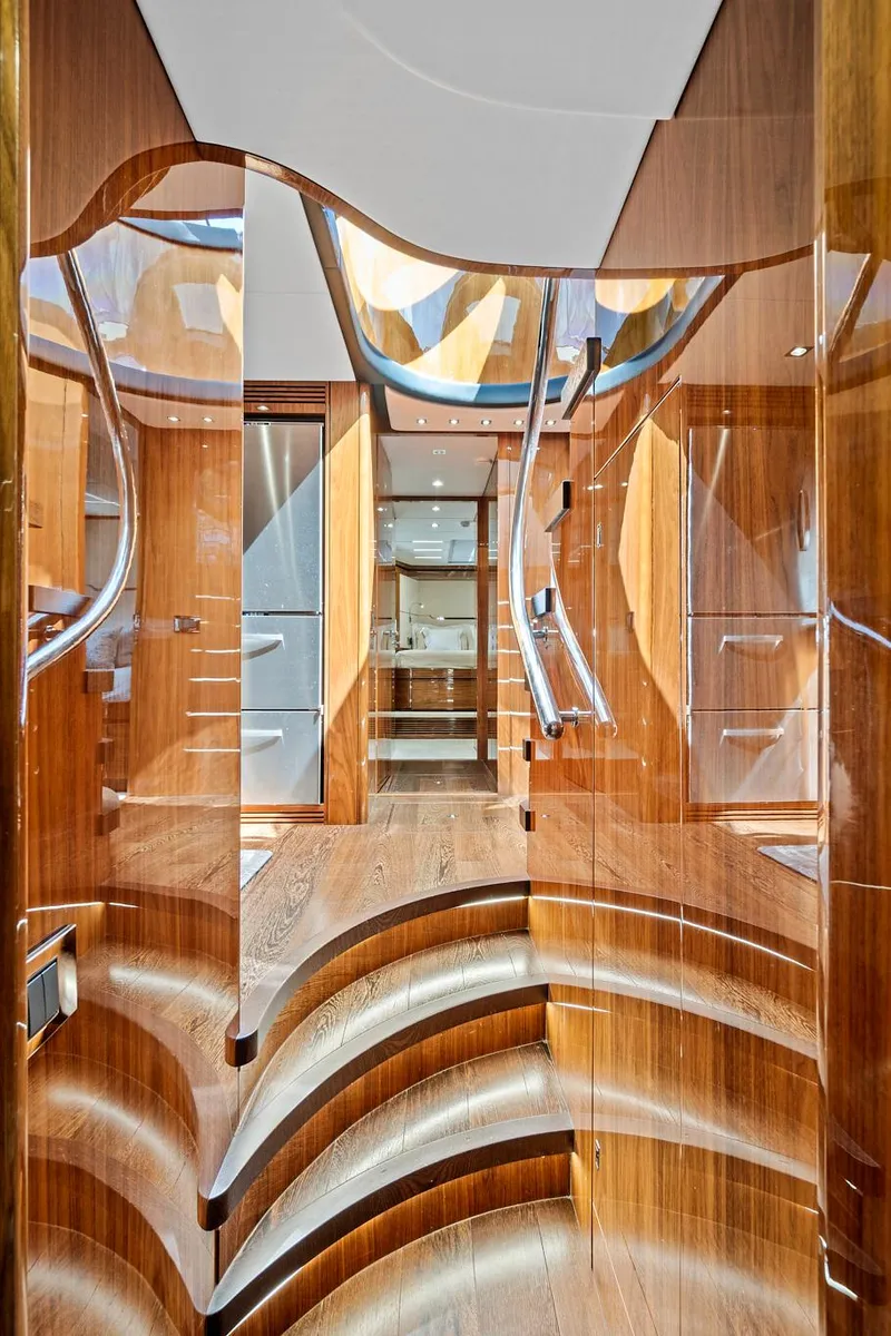 Slide: The Image of Interior of 2017 Sunseeker 68 Sport Yacht with polished wooden stairs and modern design. - 40