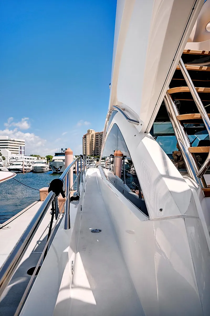 Slide: The Image of 2017 Sunseeker 68 Sport Yacht docked at a marina on a sunny day. - 5