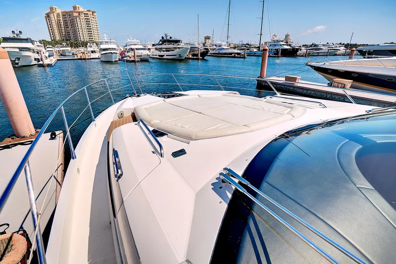 Slide: The Image of 2017 Sunseeker 68 Sport Yacht docked at a marina with other boats. - 6