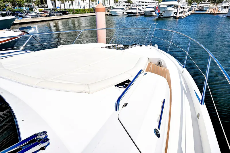 Slide: The Image of 2017 Sunseeker 68 Sport Yacht bow view at marina. - 7