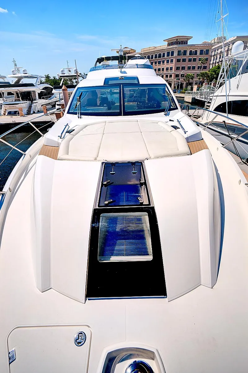 Slide: The Image of 2017 Sunseeker 68 Sport Yacht docked at a marina. - 8