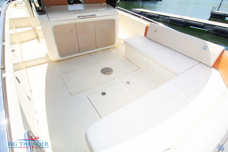 Slide: The Image of 2024 Invictus GT320S boat interior with seating and storage compartments. - 13
