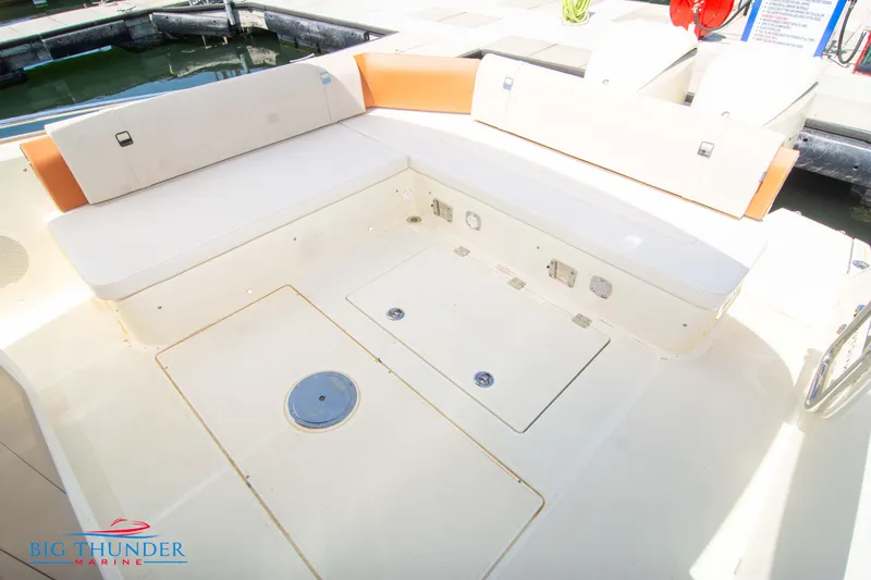 Slide: The Image of 2024 Invictus GT320S boat seating area with storage compartments at Big Thunder Marine. - 14