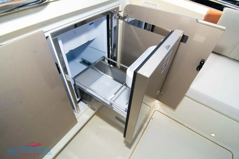 Slide: The Image of Built-in refrigerator drawer on the 2024 Invictus GT320S yacht. - 18