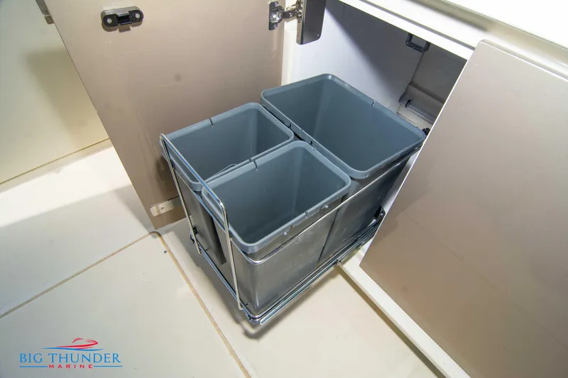 Slide: The Image of 2024 Invictus GT320S boat storage compartment with pull-out bins - 20