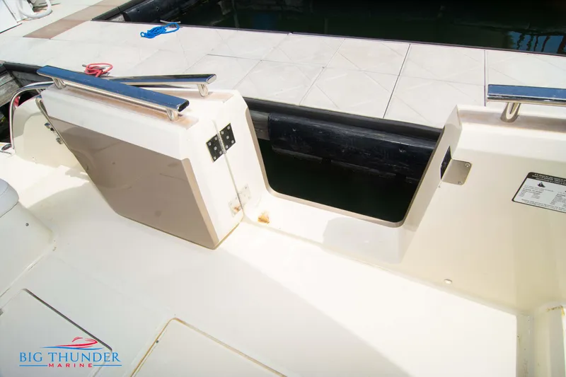 Slide: The Image of 2024 Invictus GT320S boat deck with Big Thunder Marine logo. - 21