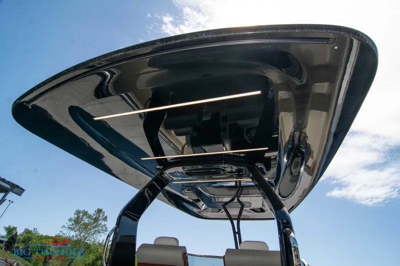 Slide: The Image of 2024 Invictus GT320S boat canopy with sleek design and integrated lighting. - 22