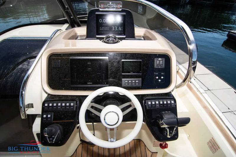 Slide: The Image of 2024 Invictus GT320S boat dashboard with advanced navigation and control systems. - 24