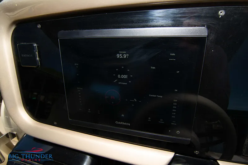 Slide: The Image of Invictus GT320S 2024 dashboard with Garmin display and Big Thunder Marine logo. - 29