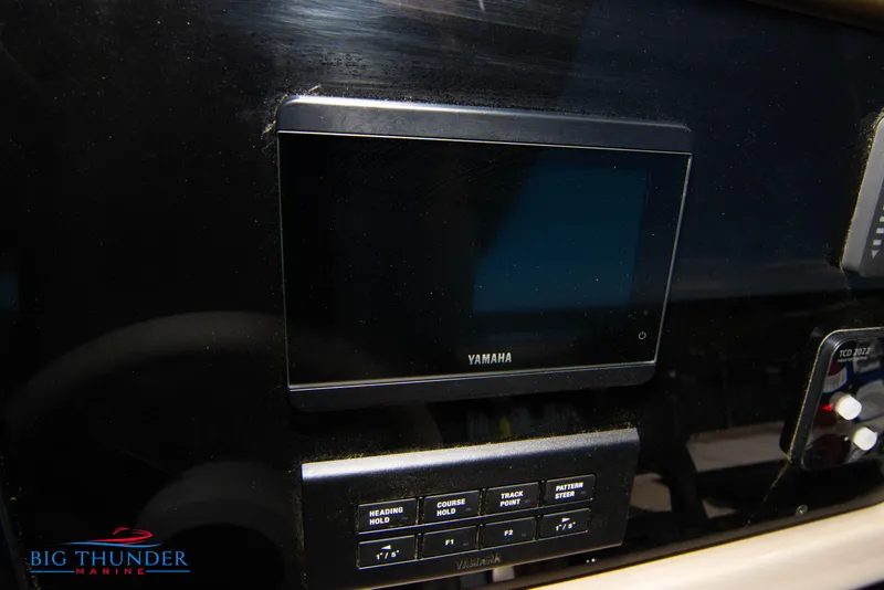 Slide: The Image of 2024 Invictus GT320S dashboard with Yamaha display and control panel. - 30