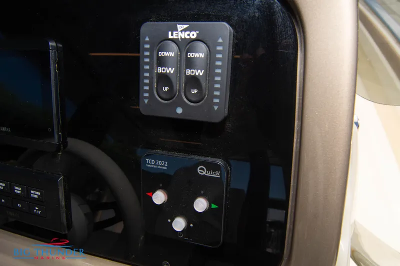 Slide: The Image of Control panel of the 2024 Invictus GT320S boat with Lenco and Quick systems. - 36