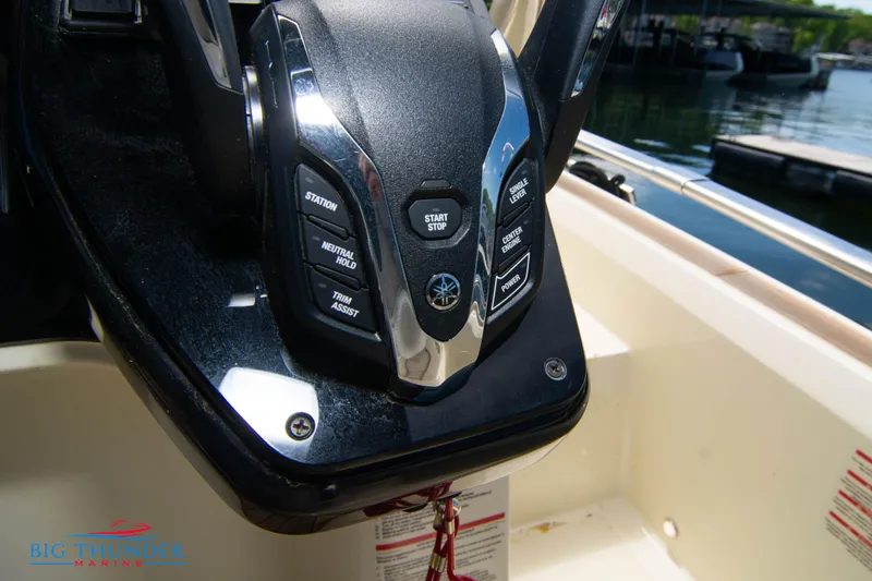 Slide: The Image of Close-up of the 2024 Invictus GT320S boat control panel. - 39
