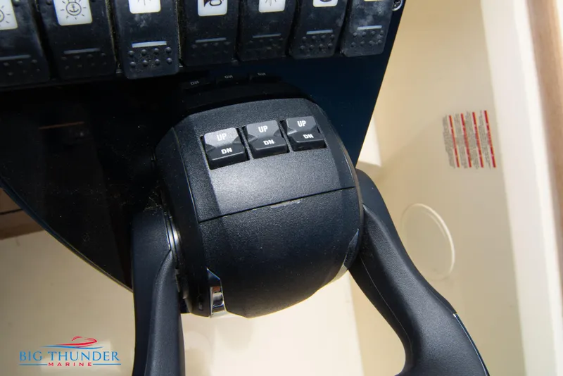 Slide: The Image of Close-up of the throttle control panel on a 2024 Invictus GT320S boat. - 40