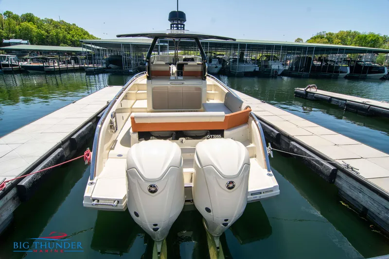 Slide: The Image of 2024 Invictus GT320S boat with twin engines docked at marina. - 5