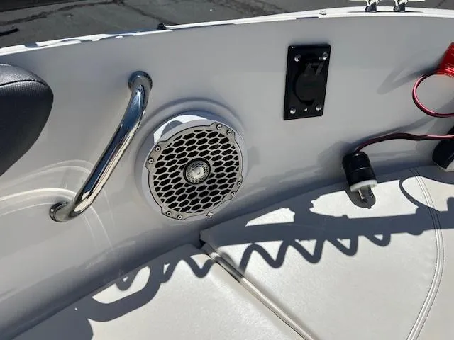 Slide: The Image of 2018 Sea Ray SPX 190 boat interior with speaker and handrail. - 11