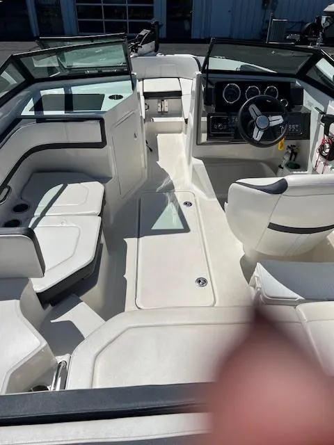 Slide: The Image of 2018 Sea Ray SPX 190 boat interior with seating and steering console. - 4