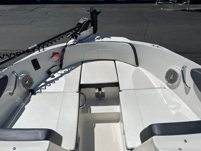 Slide: The Image of 2018 Sea Ray SPX 190 boat interior with white seating and speakers. - 7