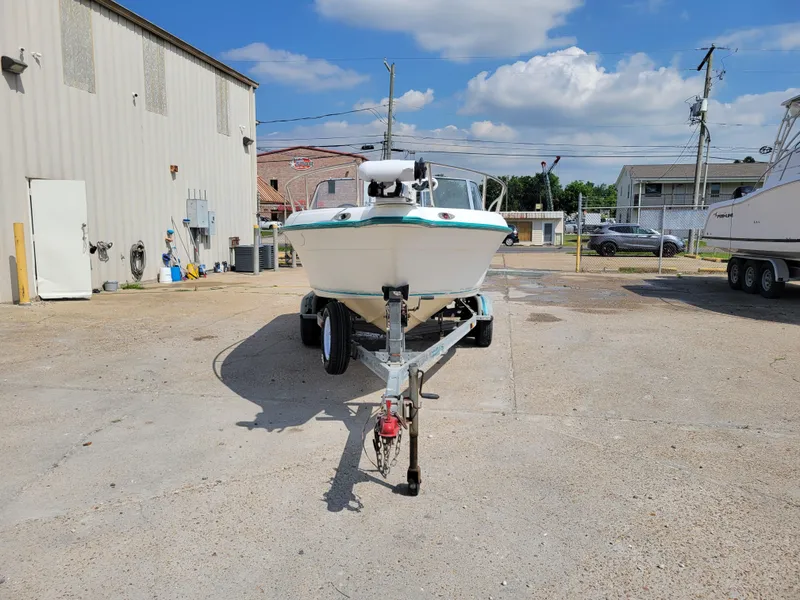 Slide: The Image of Key West 2020 Dual Console boat on trailer in a parking lot, front view. - 5