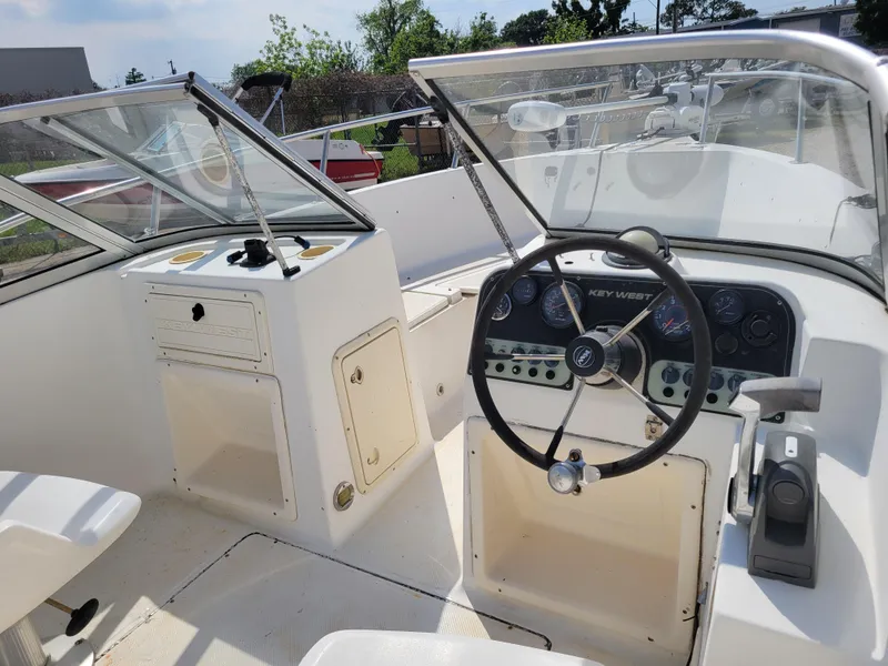 Slide: The Image of Key West 2020 Dual Console 2000 model boat interior with steering wheel and dashboard. - 8